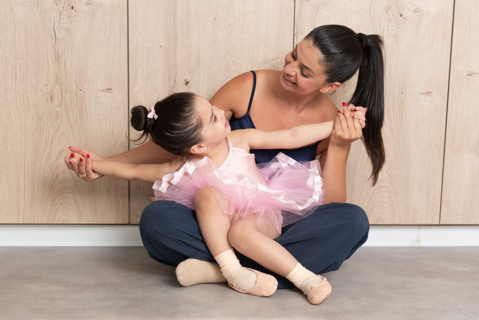 Teacher and toddler dancing together in the studio
